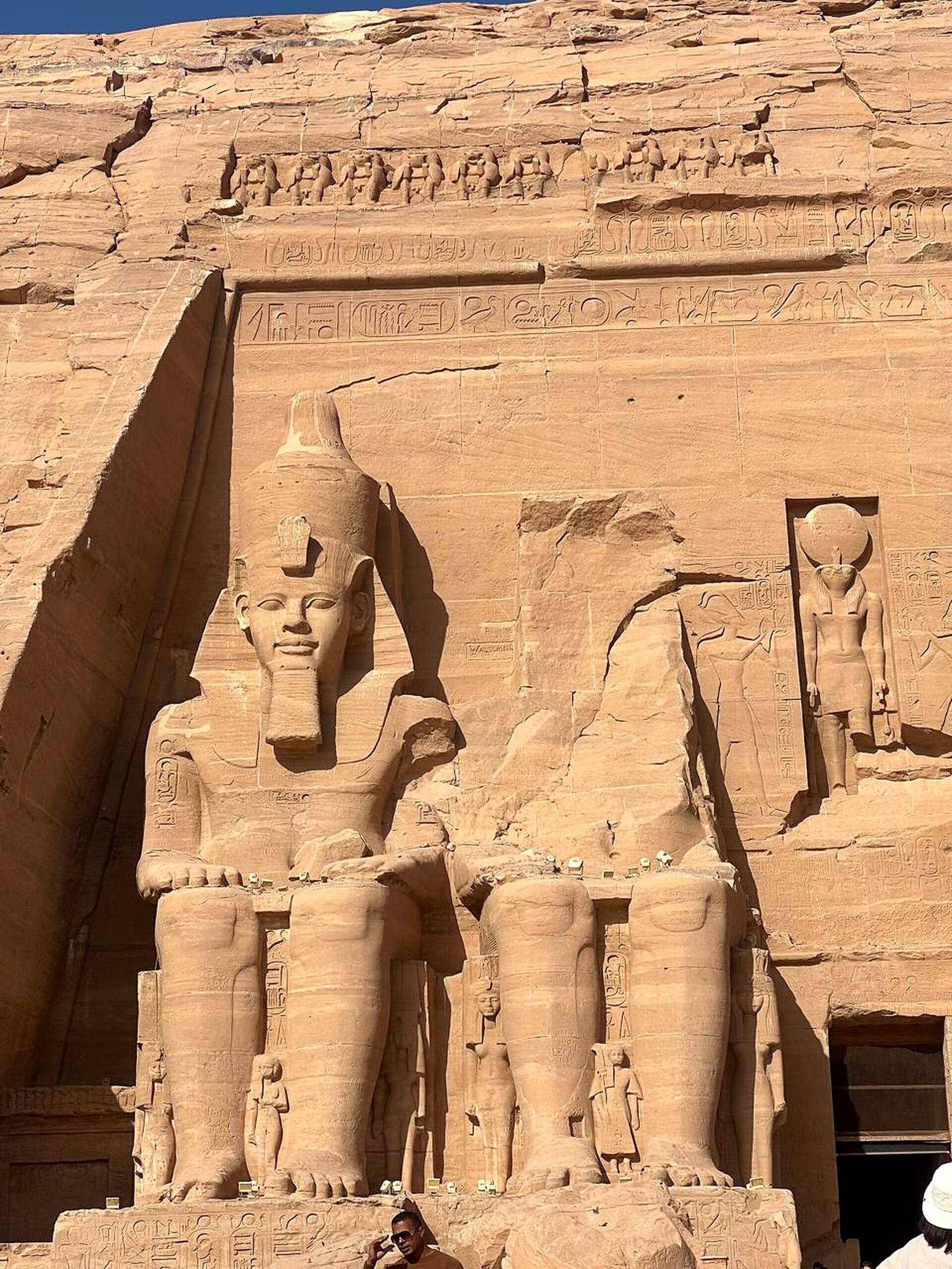 Colossal seated statues and carved sandstone facade of Abu Simbel Temple
